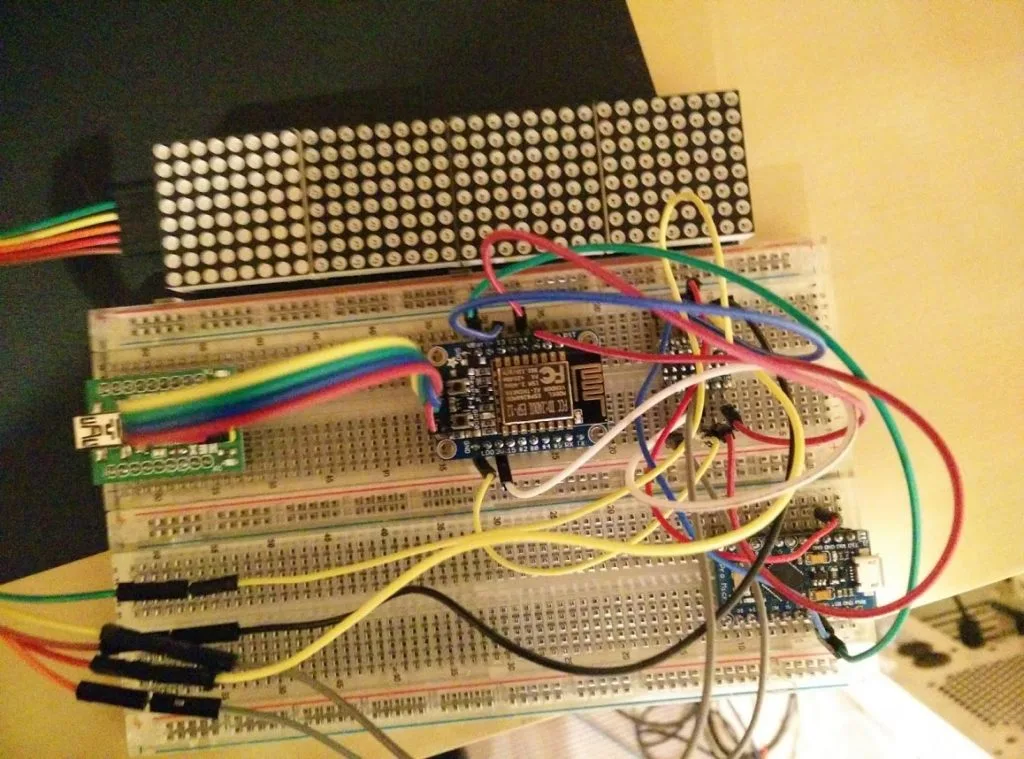 Breadboard build of the ESP8266 LED matrix clock with logic level shifter and debug wiring