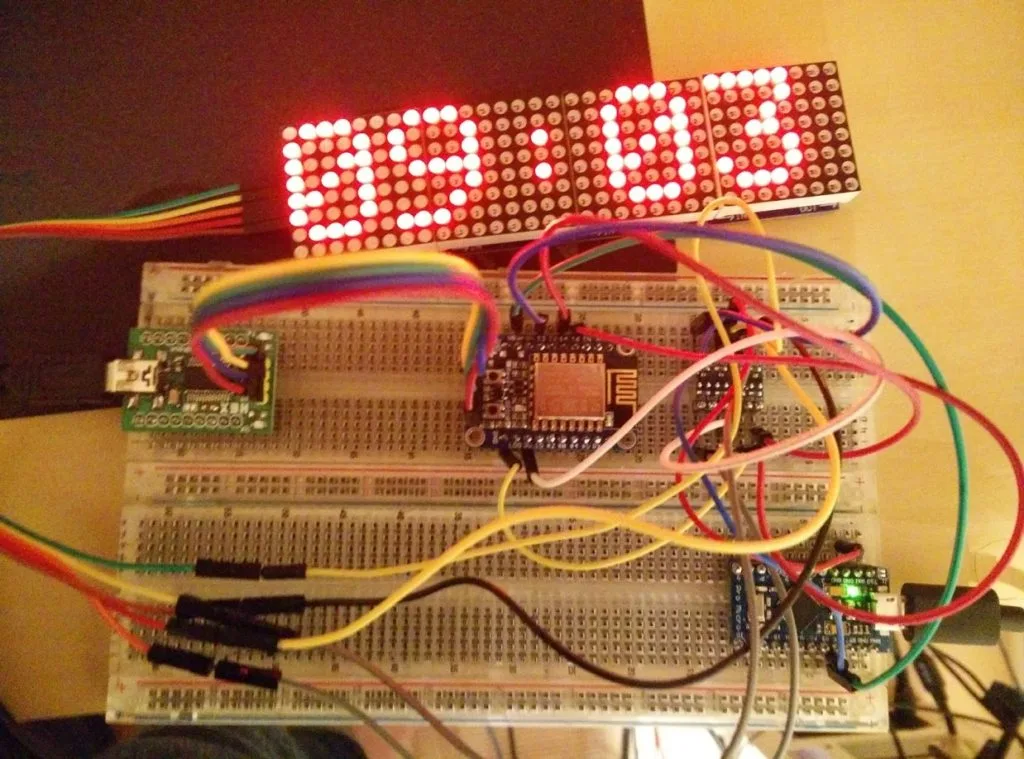 ESP8266-powered LED matrix clock displaying the time on its dot matrix panel